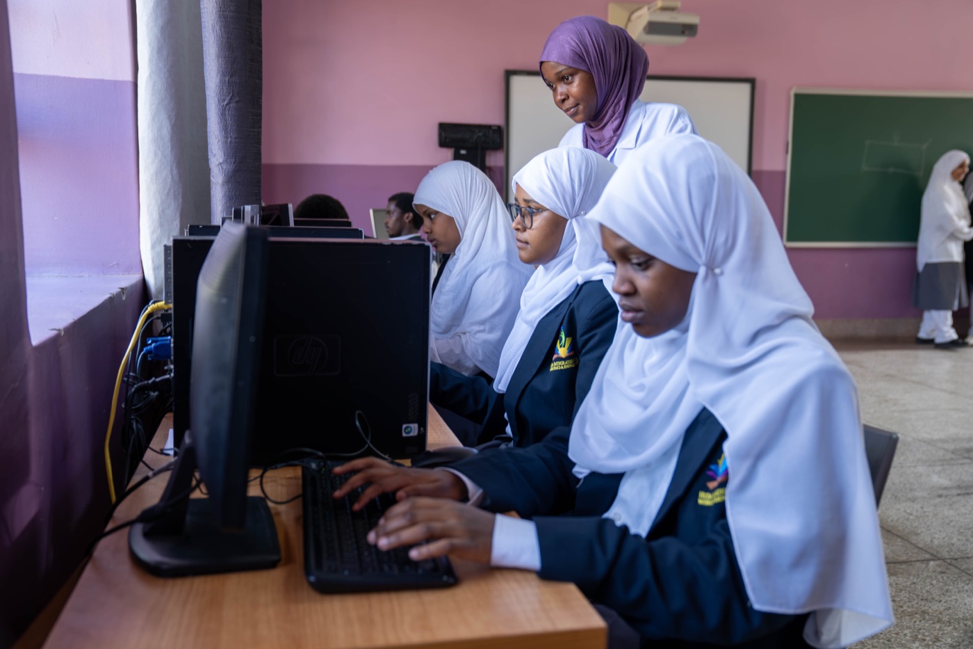 Pupils working at computers in the Huda Integrated School ICT lab