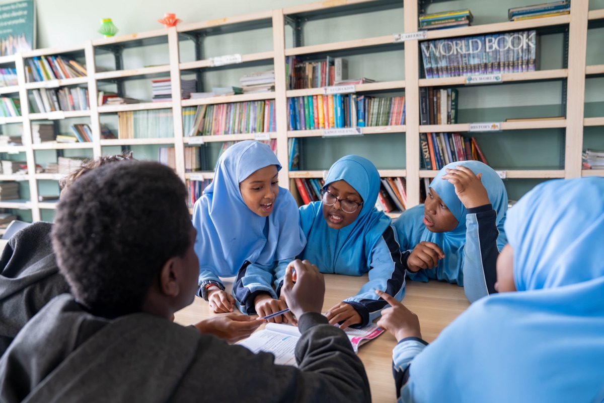 Pupils reading together in the library at Huda Integrated School