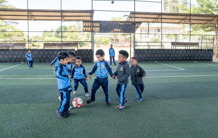 Pupils playing football at Huda Integrated School