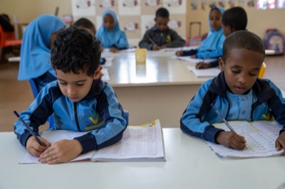 Kindergarten pupils painting in class at Huda Integrated School
